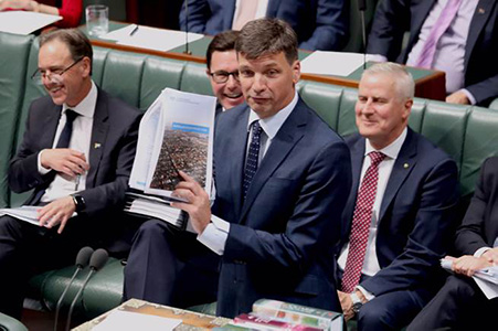 Angus Taylor and his documents. PHOTO: Mike Bowers / The Guardian